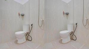 Ванная комната в OYO 92946 Dekna Homestay Syariah +68 фотографий