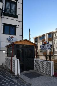 a building with a sign that reads kanyeryelieliisks at KAYACİTY Rezidans in Nevsehir