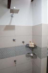 a bathroom with a shower with a glass door at Villa Sky View Hikka in Hikkaduwa