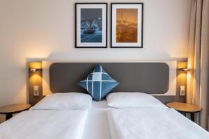 Ένα ή περισσότερα κρεβάτια σε δωμάτιο στο GHOTEL hotel & living Hannover