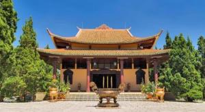 a large building with a statue in front of it at ADALY Hotel in Xuan An +19 photos