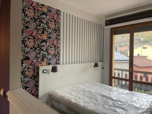 Ένα ή περισσότερα κρεβάτια σε δωμάτιο στο Don Carlo