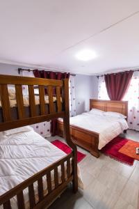 a bedroom with two bunk beds and a window at Bethel house in Ruiru