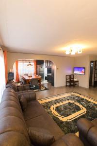 a living room with a couch and a table at Bethel house in Ruiru +3 photos
