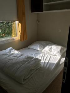 Кровать или кровати в номере Mobilhome confort 4-6 personnes