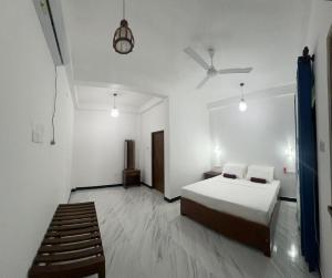 a bedroom with a bed and a ladder in it at The Secret Garden Sigiriya in Sigiriya