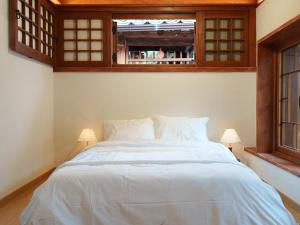 En eller flere senge i et værelse på 아린정 + 4 billeder