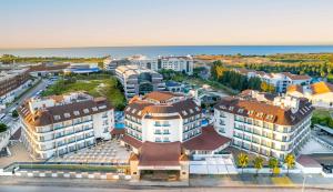 an aerial view of a city with buildings and the ocean at Ramada Resort Side in Side