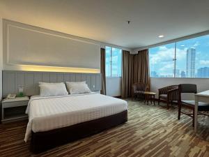 Ένα ή περισσότερα κρεβάτια σε δωμάτιο στο Hotel Continental Penang