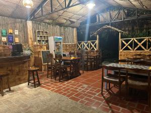 a restaurant with tables and chairs in a room at Peaceful refuge homestay in Ninh Binh
