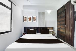 Ένα ή περισσότερα κρεβάτια σε δωμάτιο στο Collection O Jaipur Birla Temple Formerly Hotel Sky Heights +23 φωτογραφίες