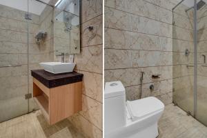 Un baño con inodoro, lavabo y ducha. en Collection O Amritsar Bus Stand Formerly Hotel Ricky International, en Amritsar