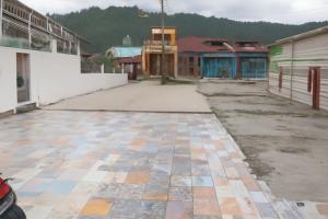 an empty street in a town with buildings at Luxe5 Inn Hj Hasnah Hasan in Takengon