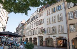 a group of buildings on a street in a city at Le Gutenberg in Strasbourg