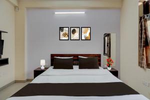 Ένα ή περισσότερα κρεβάτια σε δωμάτιο στο Hotel O Jagatpura Central Railway Station Jaipur