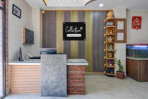 an office with a counter with a sign on the wall at Collection O Asian Highway Near Agrasen Hospital Siliguri Formerly Ashiyana Homestay in Binnāguri