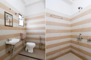 a bathroom with a toilet and a sink at Collection O Asian Highway Near Agrasen Hospital Siliguri Formerly Ashiyana Homestay in Binnāguri