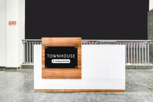 a sign for a town house on a stage at Townhouse Sector 102 Noida in Noida