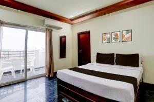 Postel nebo postele na pokoji v ubytování Collection O Chirala Beach View Formerly Sea Shell Resort + 23 fotografií