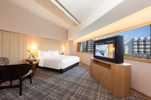 TV a/nebo společenská místnost v ubytování Xence hotel Xiamen