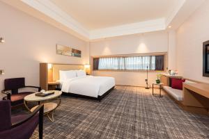 Postel nebo postele na pokoji v ubytování Xence hotel Xiamen + 63 fotografií