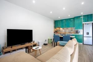 TV a/nebo společenská místnost v ubytování Vintage Gonçalo Lagoa Stay