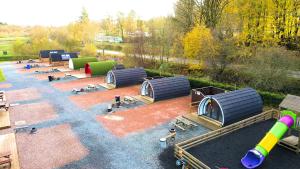 an aerial view of a playground with domes and benches at Barrhill Holiday Park - Glamping in South West Scotland - Stinchar in Girvan