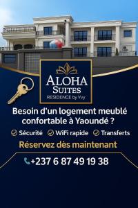 Un cartel delante de una casa con un edificio. en Aloha Suites Odza - by Skyline Residence Services, en Yaoundé