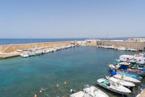 a group of boats are docked in a harbor at Dimore di Matilde - Alta Marea in Gallipoli