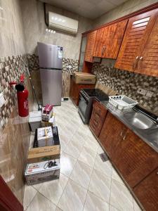 Kuchyň nebo kuchyňský kout v ubytování Bloomfields Modern 1Br Apt Brieki Al Ain