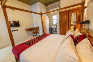 a bedroom with a large bed in a room at W H Nest Hostel in Cochin