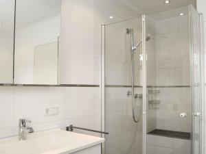 a bathroom with a glass shower and a sink at Fewo Wrede am Sauerland-Radring in Wenholthausen +14 photos