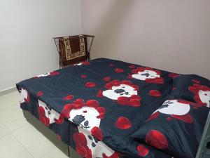 Postel nebo postele na pokoji v ubytování QAUSAR HOMESTAY KERLING Hulu Selangor