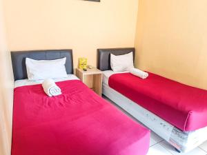 Una cama o camas en una habitación de The Legian 777