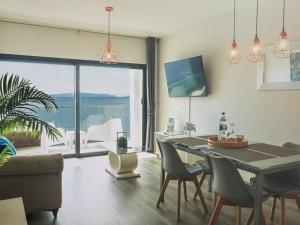 a living room with a table and chairs and a large window at Tranquil Escape in Gaula