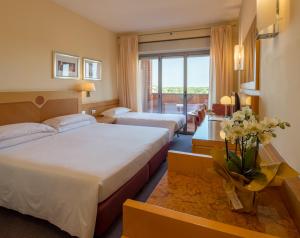 Posteľ alebo postele v izbe v ubytovaní Best Western Hotel I Triangoli + 37 fotografií