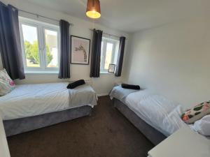 Voodi või voodid majutusasutuse Kensington House- The Perfect home for contractor stays toas