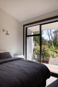 Postel nebo postele na pokoji v ubytování Minden Retreat