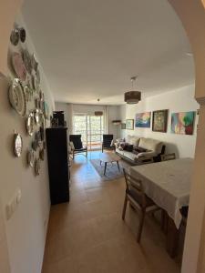 a living room with a table and a couch at Apartment Mountain View in Torrox