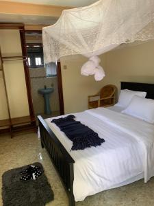 Postel nebo postele na pokoji v ubytování Montane Safaris Hotel FortPortal