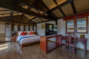 Ένα ή περισσότερα κρεβάτια σε δωμάτιο στο Yyj Island Garden Resorts Lijiang
