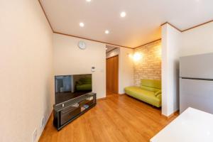 TV a/nebo společenská místnost v ubytování ソレイユ白浜 + 21 fotografií