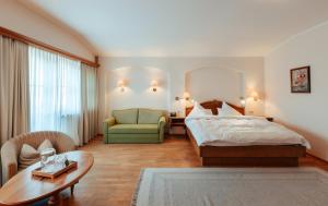 Ένα ή περισσότερα κρεβάτια σε δωμάτιο στο Biohotel Schweitzer