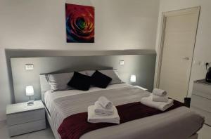 Ένα ή περισσότερα κρεβάτια σε δωμάτιο στο Residenza Le Rose