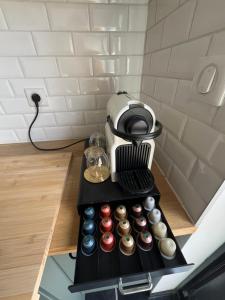 a coffee maker sitting on top of a counter at Appart' Zen & connect in Ennevelin