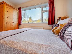 Un pat sau paturi într-o cameră la Blengfell by Prestige Properties SA