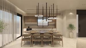 a dining room with a table with chairs and a chandelier at Nysa Luxury villa 3 in Anissaras