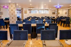 a dining room with tables and chairs at TTC Hotel - Hoi An in Hoi An