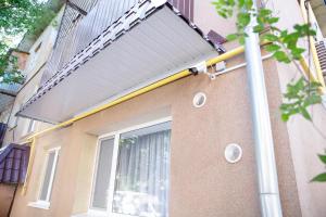 a building with a solarium on the side of it at APART-HOTEL VEGUS in Uralsk