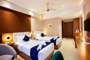 Ένα ή περισσότερα κρεβάτια σε δωμάτιο στο Hotel dreamland residency